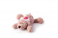 Lying Lumpin bear with ribbon